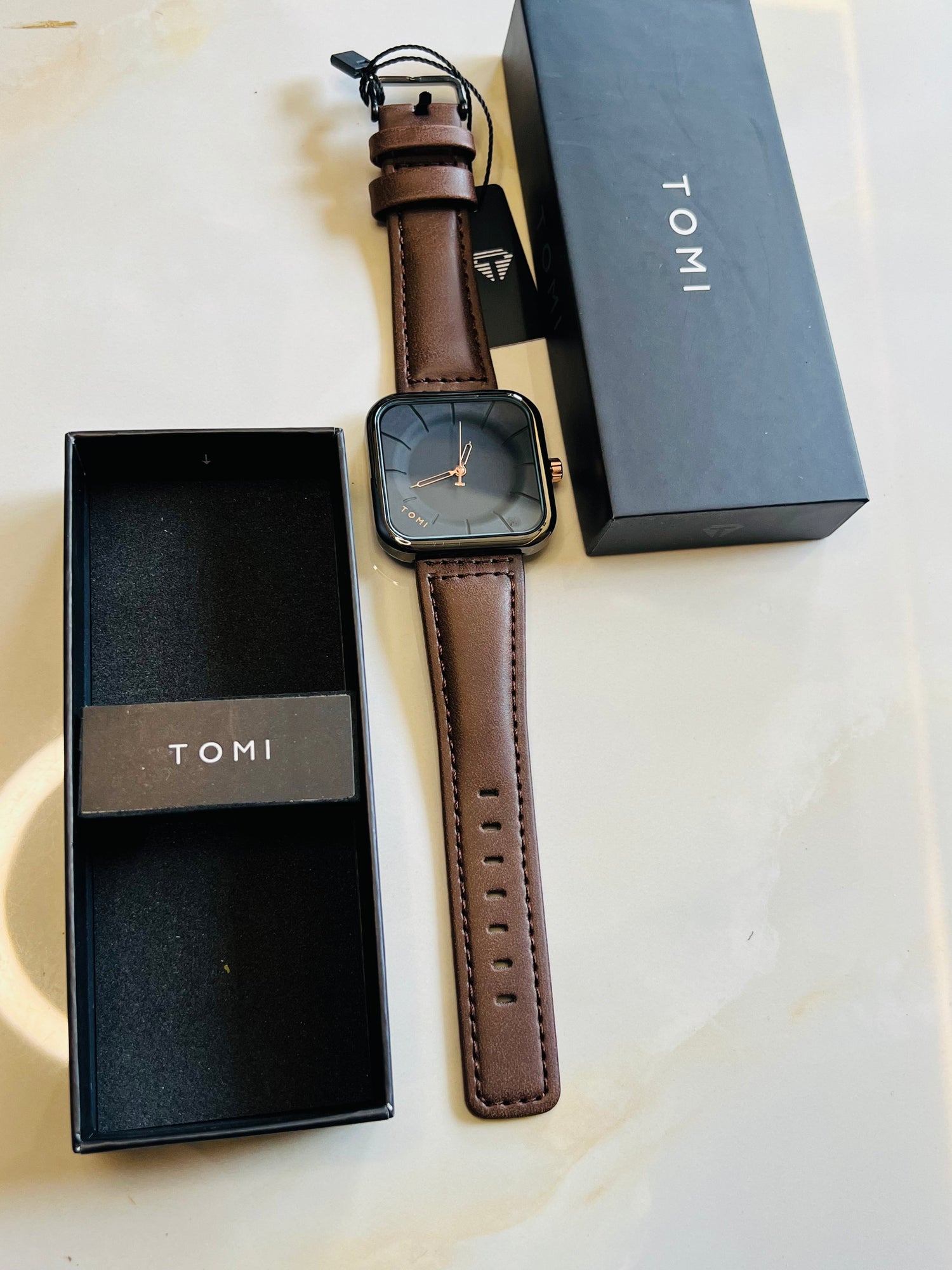 Tomi